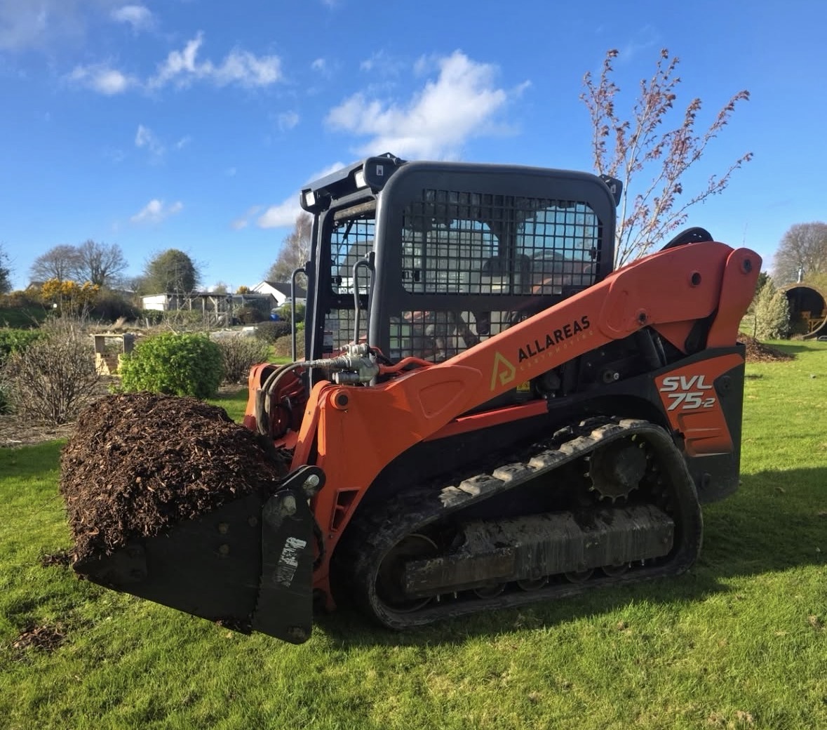 Kubota SVL75-2 tracked loader on a landscaping job